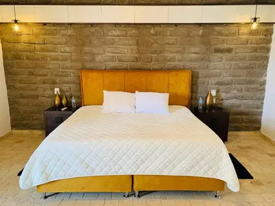 Cama o camas de una habitación en Hotel Boutique Embrujo Místico