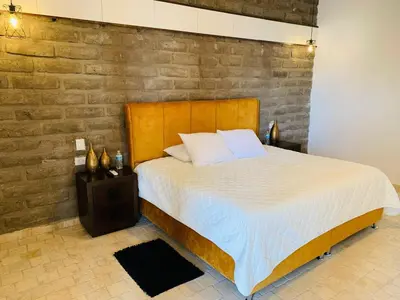 Cama o camas de una habitación en Hotel Boutique Embrujo Místico