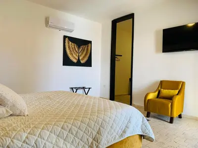 Cama o camas de una habitación en Hotel Boutique Embrujo Místico