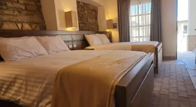 Cama o camas de una habitación en Hotel Villa de la Parra