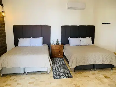 Cama o camas de una habitación en Hotel Boutique Embrujo Magia