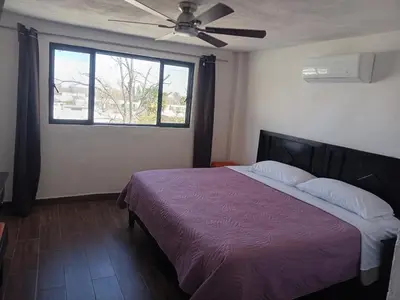 Cama o camas de una habitación en La Terraza-Habitación 8