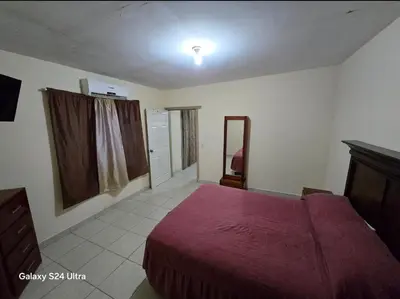Cama o camas de una habitación en Departamentos nicol
