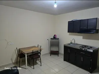 Una cocina o zona de cocina en Departamentos nicol