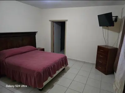Cama o camas de una habitación en Departamentos nicol
