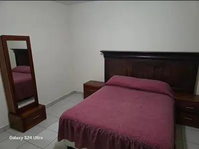 Cama o camas de una habitación en Departamentos nicol