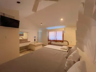 Cama o camas de una habitación en Hotel Oasis