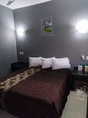 Cama o camas de una habitación en Hotel Oasis