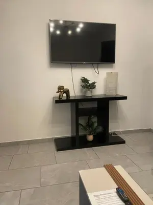 Una televisión o centro de entretenimiento en Departamento completo
