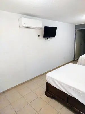 Una televisión o centro de entretenimiento en Departamento 1 cerca del CAS y consulado,CRIT,Centro de Gobierno y Galerías Mall Cómodo, moderno y con entrada autónoma