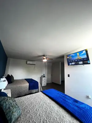 Cama o camas de una habitación en AXEL Suites Departamento 1A