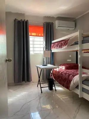 Cama o camas de una habitación en Casa con dos cómodas habitaciones