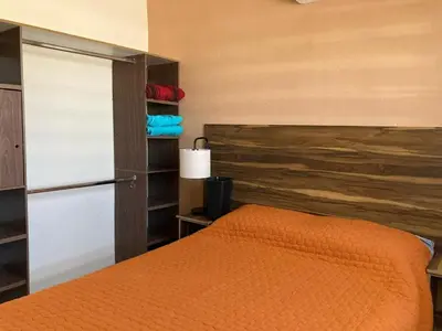 Cama o camas de una habitación en Casa con dos cómodas habitaciones