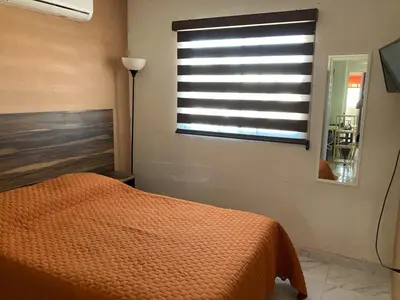 Cama o camas de una habitación en Casa con dos cómodas habitaciones