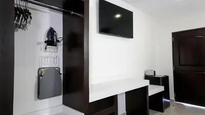 Una televisión o centro de entretenimiento en Hotel Loreto Palmar