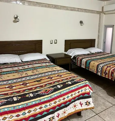 Cama o camas de una habitación en Hotel Posada del Yaqui