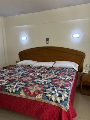 Cama o camas de una habitación en Hotel Posada del Yaqui