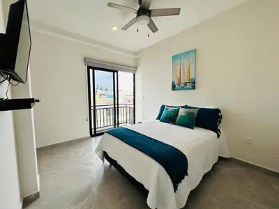 Cama o camas de una habitación en Beautiful 50 steps from the beach Torre Q