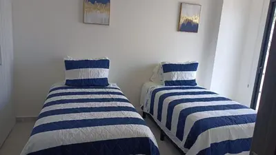 Cama o camas de una habitación en Beautiful 50 steps from the beach Torre Q