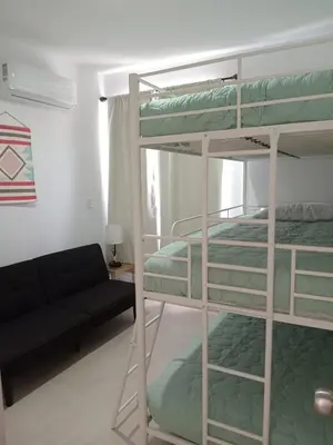 Cama o camas de una habitación en La Casita de Coco
