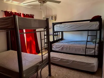 Cama o camas de una habitación en House for 20 people, close to the pier and beaches