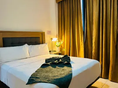 Cama o camas de una habitación en Hotel Grand Lion