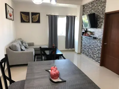Una televisión o centro de entretenimiento en Departamento en Mazatlan 5 min del Malecón