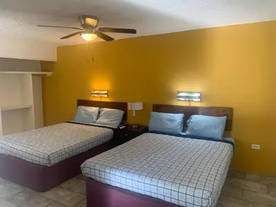 Cama o camas de una habitación en Condomino Maripina