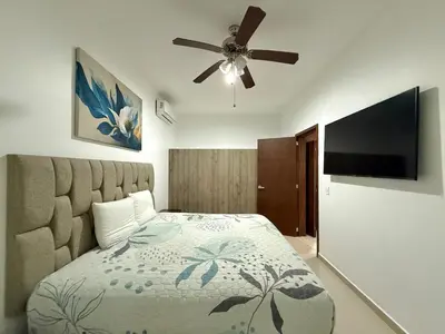 Cama o camas de una habitación en Apartment in the golden zone near the beach rincon colonial 102