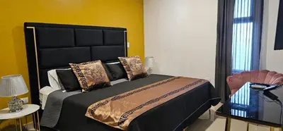 Cama o camas de una habitación en Torre 5 Mazatlán Versace Style