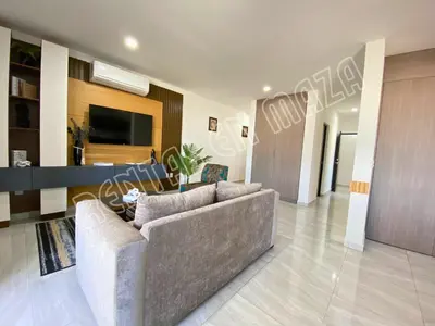 Una televisión o centro de entretenimiento en Condominios Marina Cerritos 1