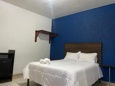 Cama o camas de una habitación en Rio inn