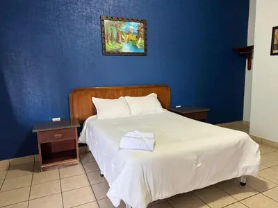 Cama o camas de una habitación en Rio inn