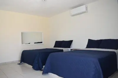 Cama o camas de una habitación en Hotel Esperanza