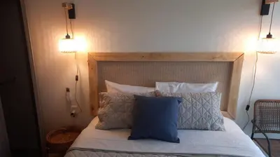 Cama o camas de una habitación en Mazablue depa en laguna con playas artificiales