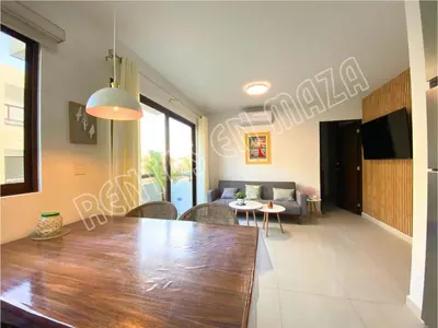 Una televisión o centro de entretenimiento en Condominio Oceanna 4