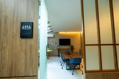 Una televisión o centro de entretenimiento en Hotel Soretti