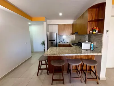 Una cocina o zona de cocina en Fantástico Depa en BLUU con PLAYA ARTIFICIAL - Turquesa 208 -