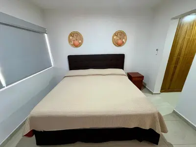 Cama o camas de una habitación en Fantástico Depa en BLUU con PLAYA ARTIFICIAL - Turquesa 208 -