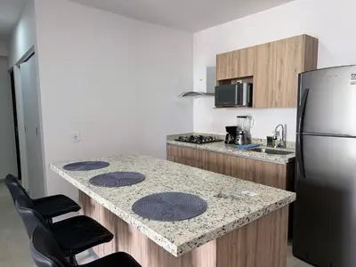 Una cocina o zona de cocina en Bluü Habitat with Beach and Premium Amenities