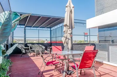 Un balcón o terraza de Two KING Size Beds in Historic Downtown DGO