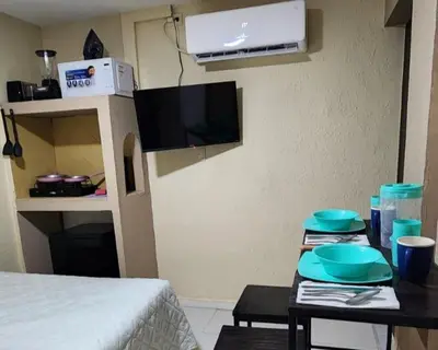 Una televisión o centro de entretenimiento en Depa Loved, 15 min Consulado, 2 min Pza Alameda