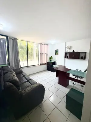 Zona de estar de Departamento Suite familiar frente a las riberas