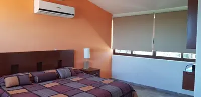 Cama o camas de una habitación en Punta cerritos