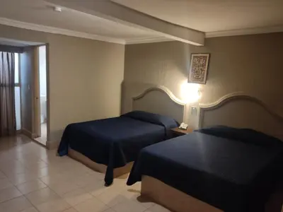 Cama o camas de una habitación en Hotel del Paseo