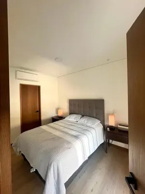 Cama o camas de una habitación en Departamento Edificio Imperia