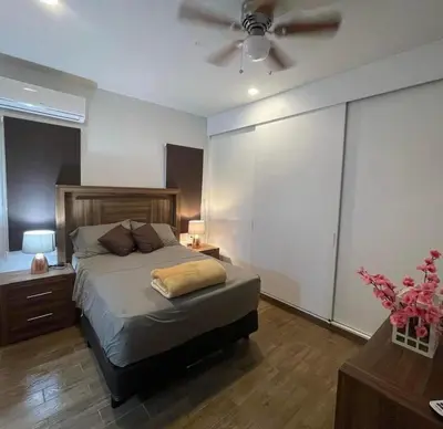 Cama o camas de una habitación en Departamento familiar
