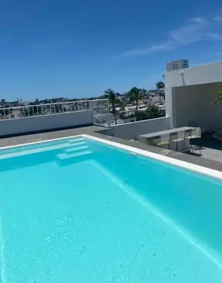 Piscina en o cerca de Departamento familiar