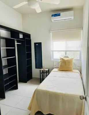 Cama o camas de una habitación en Departamento olivas