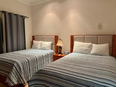Cama o camas de una habitación en Depa Frente a la Playa con Vistas en EDM